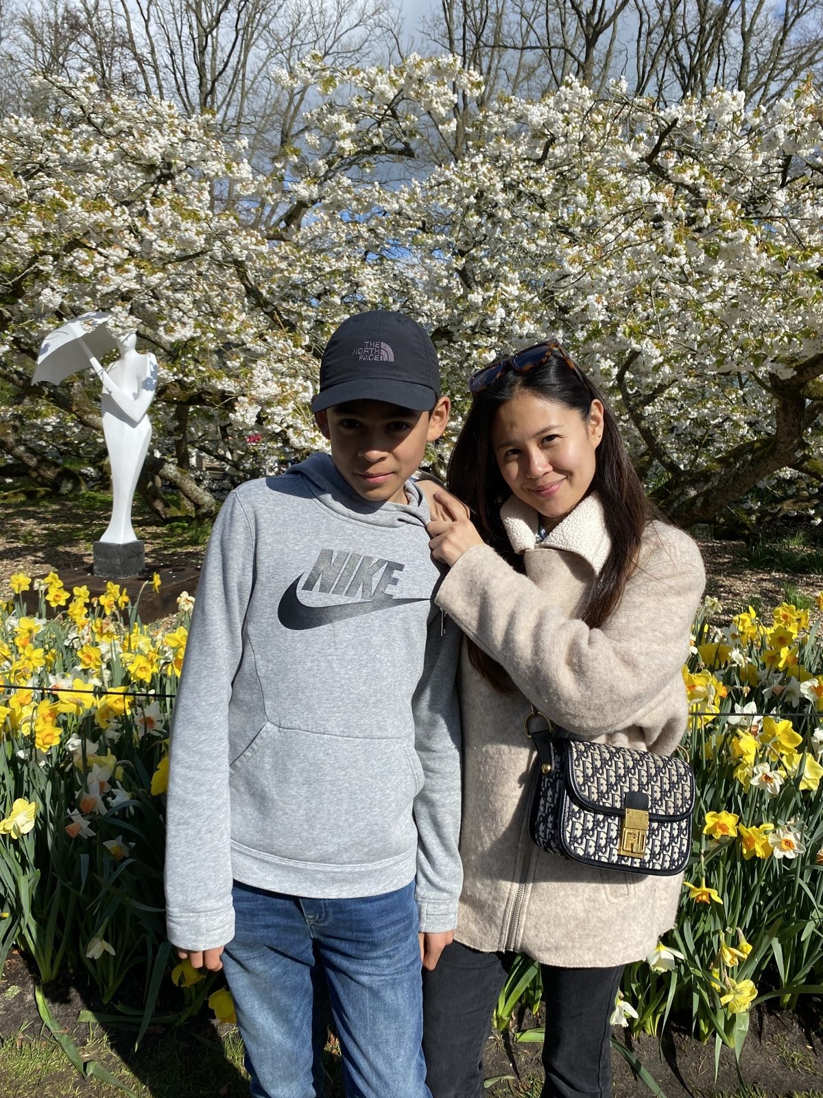 Yona and Elano together under blossom trees
